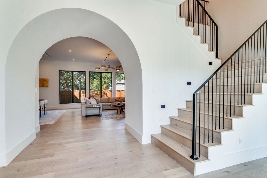 Arched opening and staircase — Select Custom Home